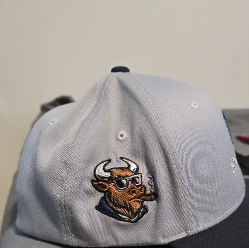 Grey cap with our bull-with-cigar mascot embroidered on the side